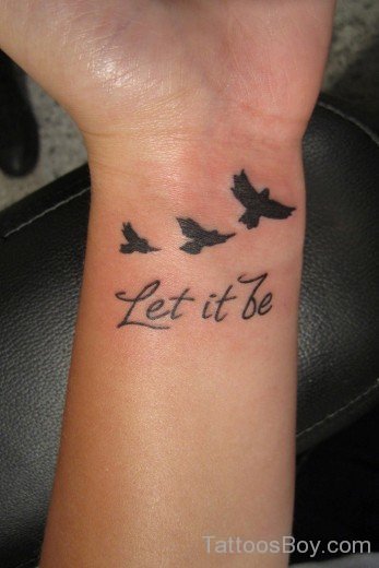Wording And Bird Tattoo On Wrist